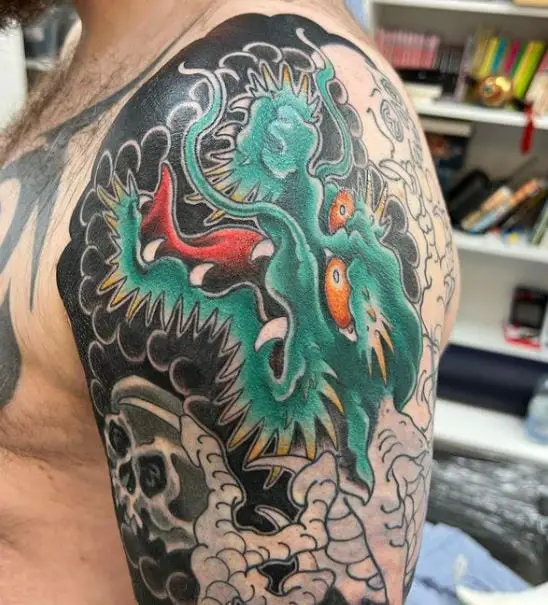 red-eyed dragon tattoo in progress