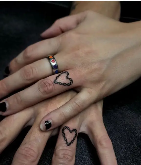 ring finger heart tattoos