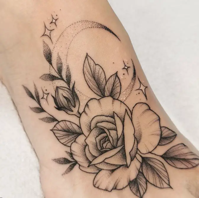 rose tattoo with moon and stars