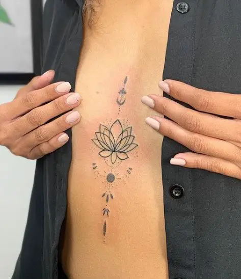 simple lotus chest tattoo