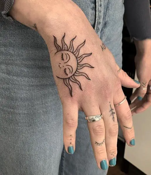 sleepy sun hand tattoo