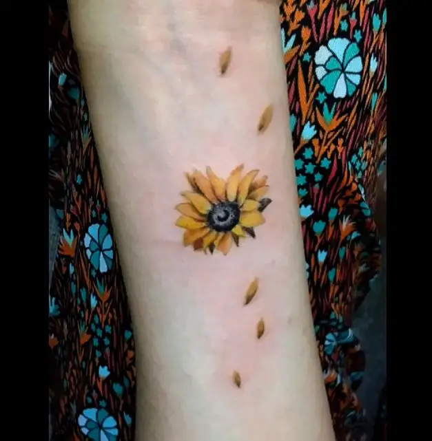 small realistic looking sunflower tattoo