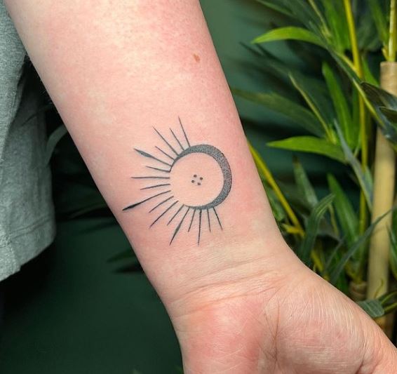 sun and moon wrist tattoos