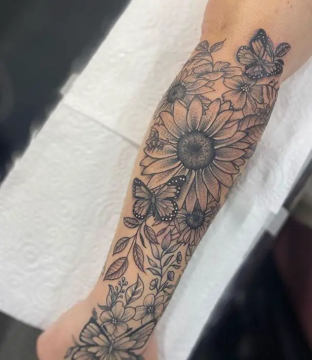 sunflower and butterfly tattoo in black