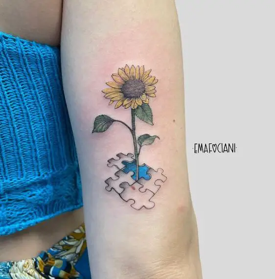 sunflower and puzzle tattoo in colour
