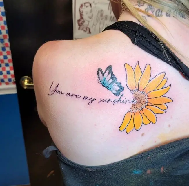 sunflower, butterfly, and wording tattoo