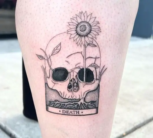 sunflower from a skull tattoo on the leg