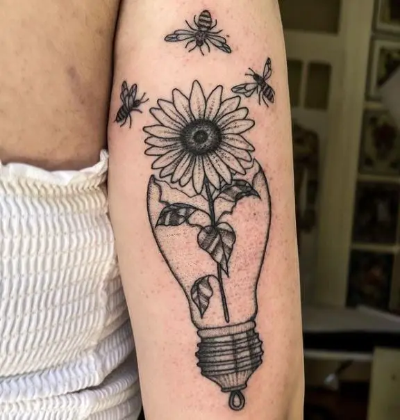 sunflower in a broken bulb and bees tattoo