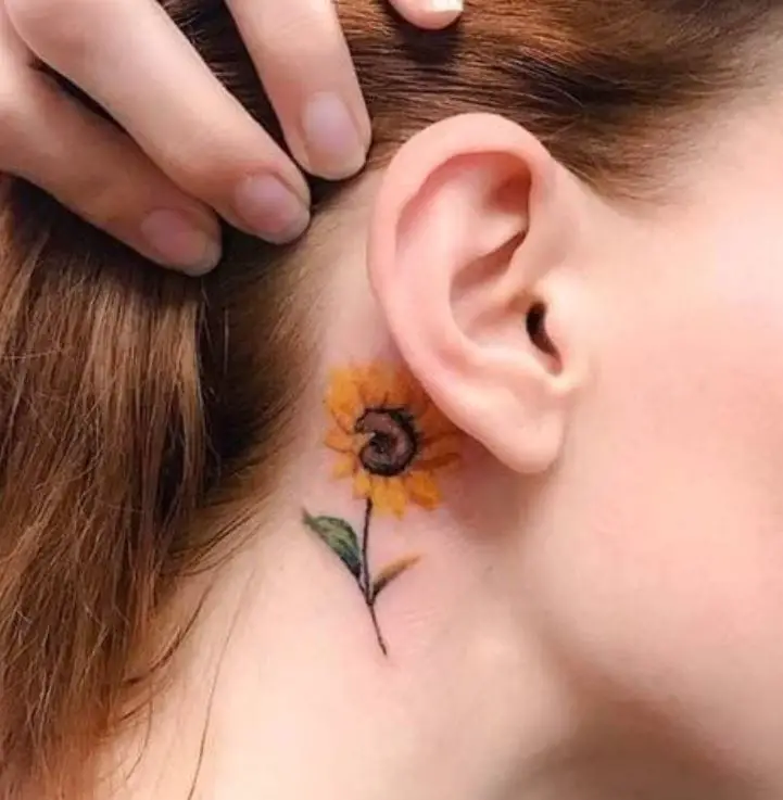sunflower tattoo behind the ear