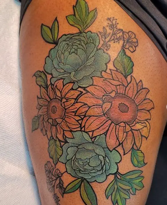 sunflower tattoo on the thigh