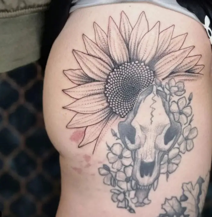 sunflower tattoo with an animal skull