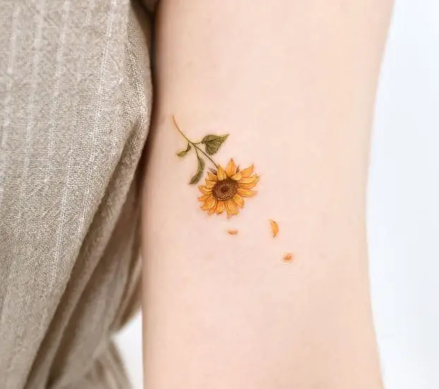 sunflower tattoo with petals falling