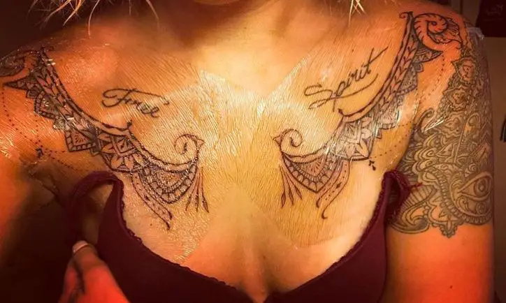 tribal duplicate tattoos on the chest