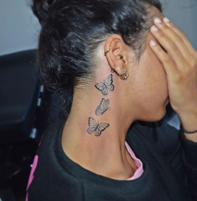 triple butterfly tattoo behind the ear