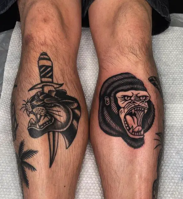 two animal tattoos on the legs
