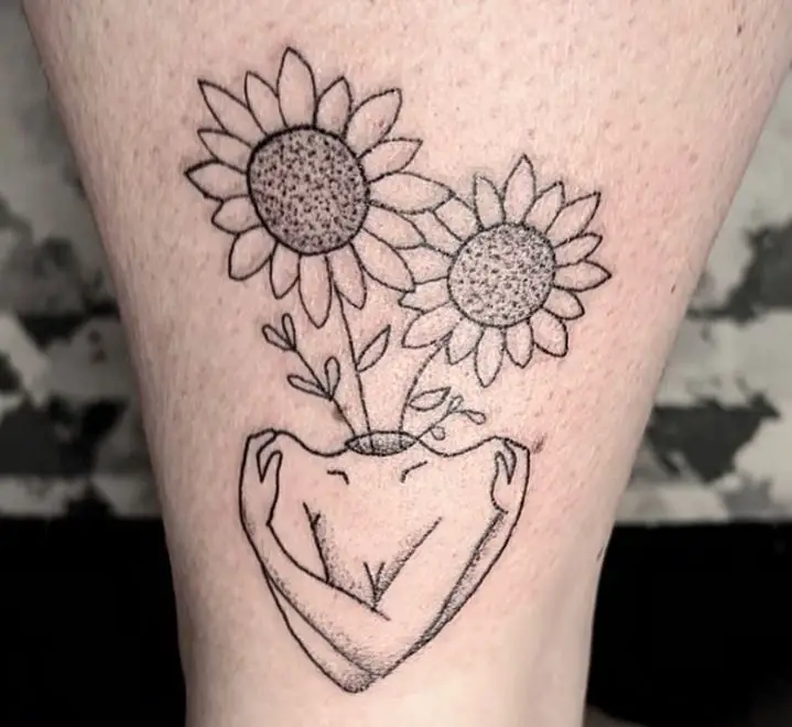 two sunflowers on the head tattoo