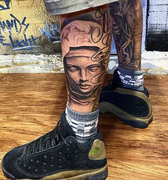 virgin mary leg tattoo