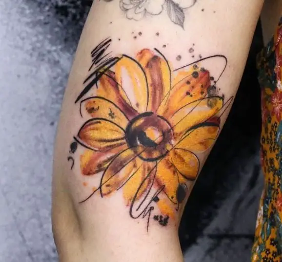 yellow floral tattoo