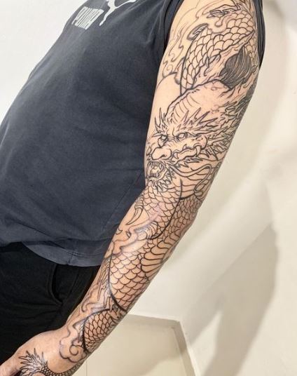 Black Inked Dragon Sleeve Tattoo