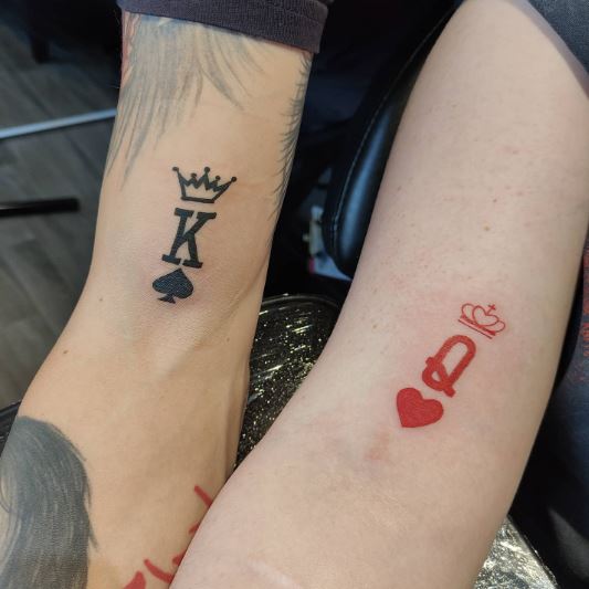 Black and Red Crowned K and Q Tattoo