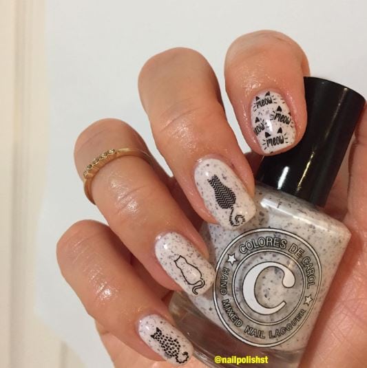 Black and White Speckled Cat Nail Design