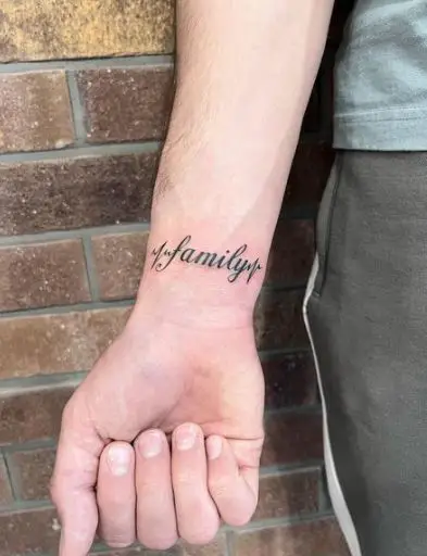 Family Lettering Tattoo on the Wrist
