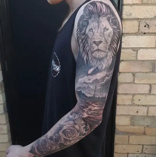 Lion and Forest Sleeve Tattoo