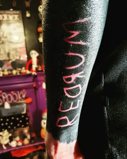 REDRUM Tattoo on Blacked Out Sleeve
