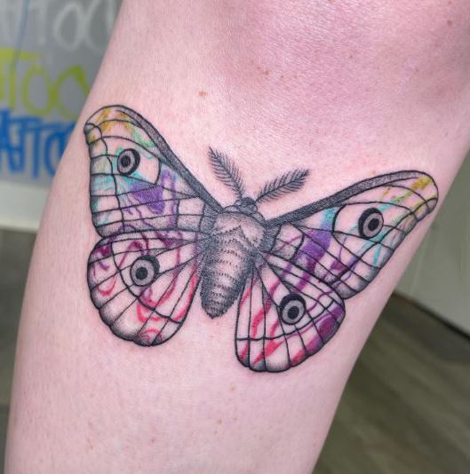 Trippy rainbow moth tattoo