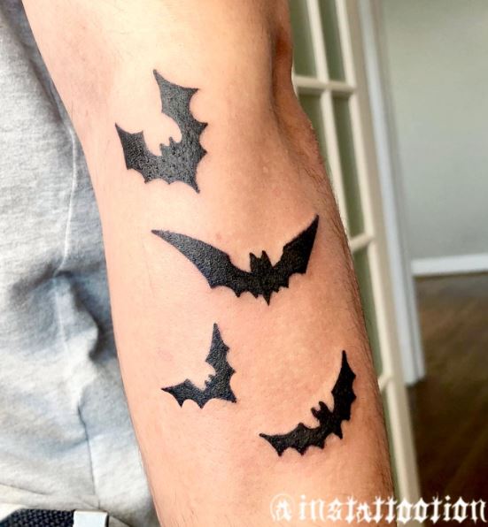 Black Flying Bats Arm Tattoo