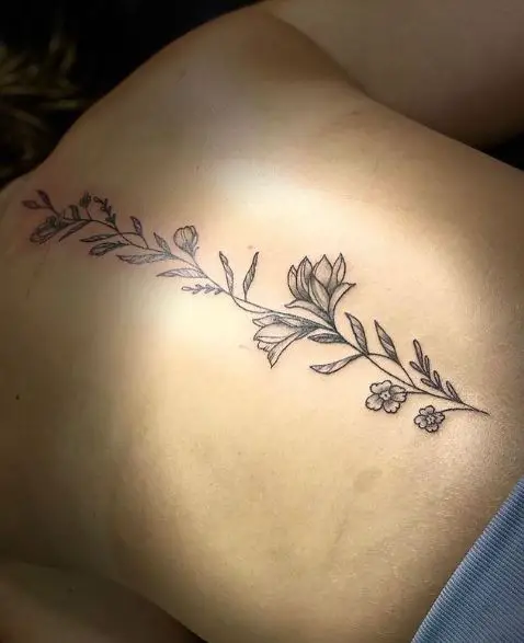 Shaded Branch with Flowers Spine Tattoo