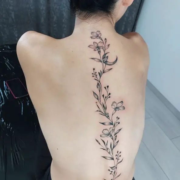 Half Moon and Flowers Spine Tattoo
