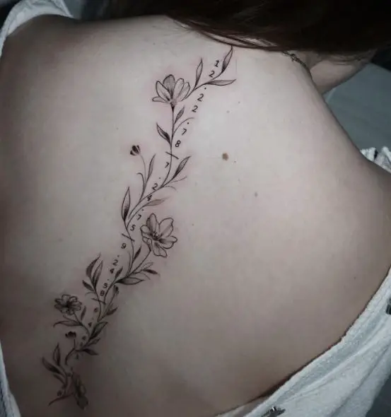 Dates and Flowers Spine Tattoo