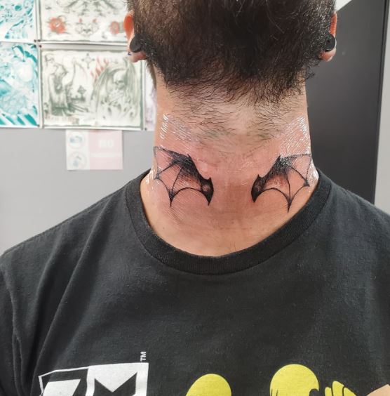 Bat Wings Neck Tattoo