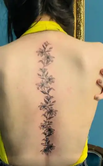 Flowers and Leaves Spine Tattoo