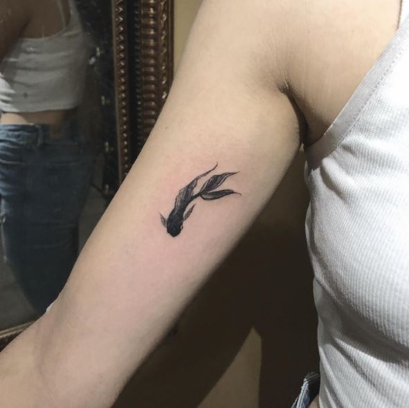 Minimalistic Koi Fish Biceps Tattoo