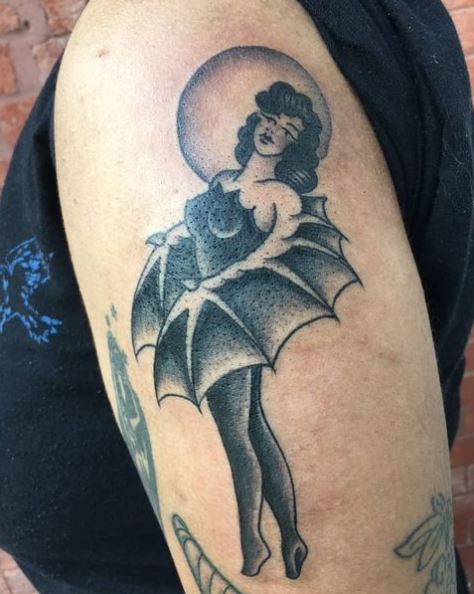 Girl with Bat Wings Arm Tattoo