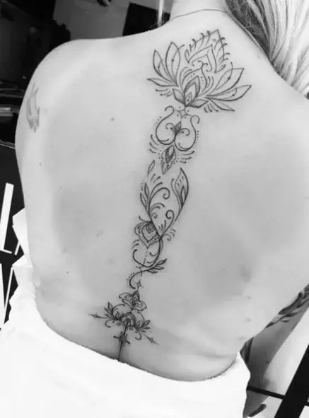 Grey Shaded Floral Spine Tattoo