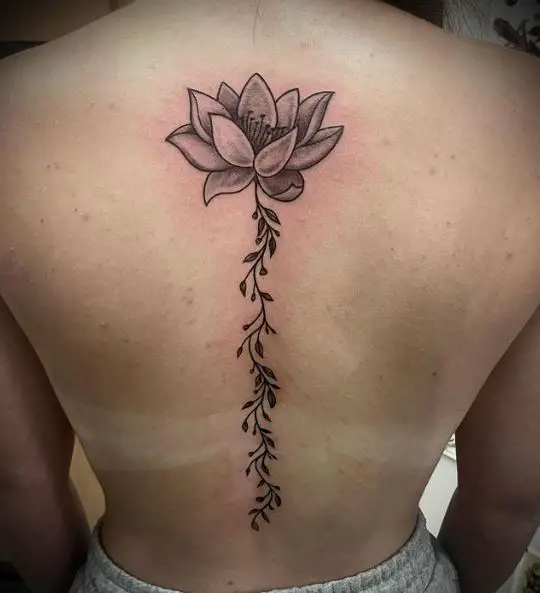Grey Lotus with Leaves Spine Tattoo