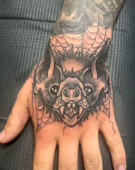 Spider Net and Vampire Bat Hand Tattoo