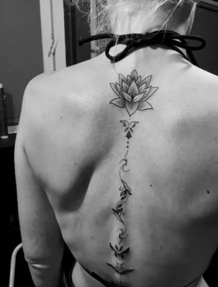 Lotus and Leaves Spine Tattoo