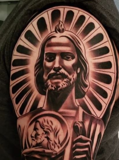 Glowing San Judas Arm Tattoo