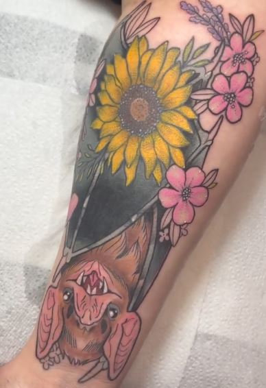 Colorful Vampire Bat with Flowers Arm Tattoo