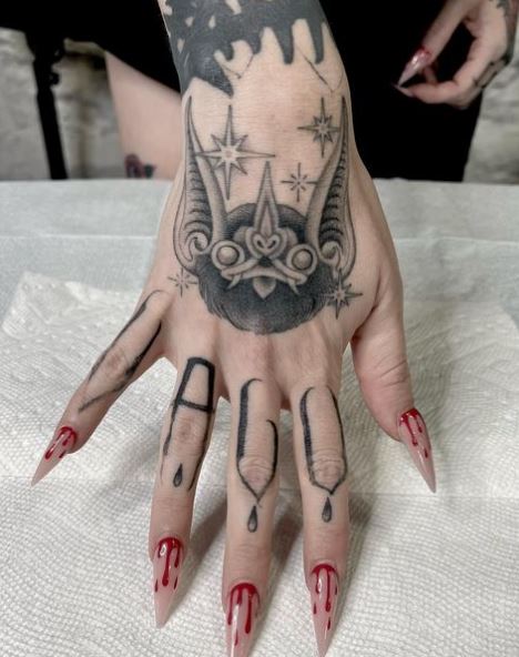 Grey Stars and Bat Hand Tattoo
