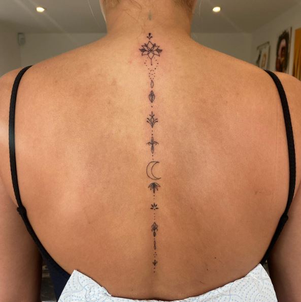 Lotus and Ornaments Spine Tattoo