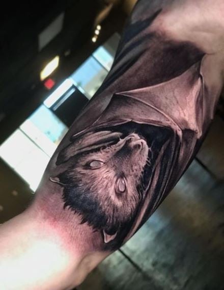 Realistic Fruit Bat Biceps Tattoo
