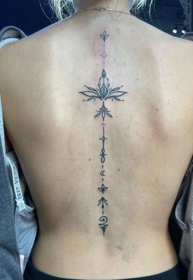 Ornament with Lotus and Moon Spine Tattoo