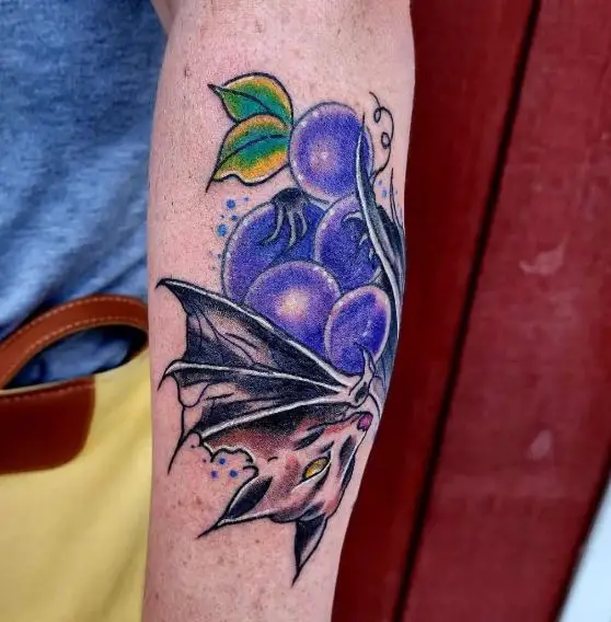 Grapes and Bat Arm Tattoo