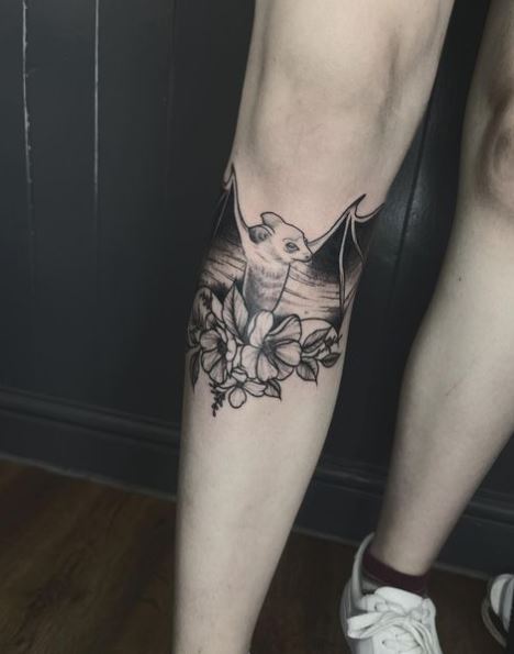 Flowers and Fruit Bat Leg Tattoo