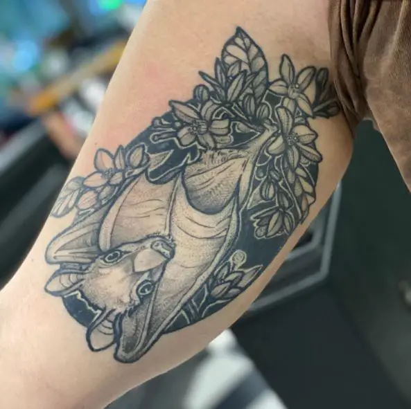 Flowers and Bat Arm Tattoo